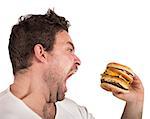 Insatiable and hungry man eating a sandwich