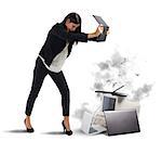 Stressed businesswoman furiously attacking computers and laptops