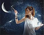 Girl paints the moon and the stars