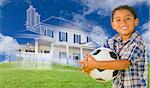Mixed Race Young Boy Holding Soccer Ball with Ghosted House Drawing, Partial Photo and Rolling Green Hills Behind.