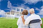 Senior Couple Faces Ghosted House Drawing, Partial Photo and Rolling Green Hills Behind.