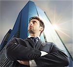 Successful businessman with skyscraper in the background