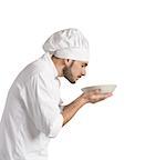 Man chef smelling the aroma of his dish