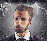 Portrait of sad businessman with storm background