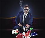 Rich gambler throws cards dice and chips
