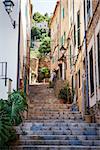 Narrow street old traditional houses village with stairs, Banyalbufar, Majorca, Spain