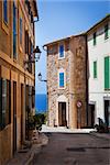 Narrow street old traditional houses village with sea view,  Banyalbufar, Majorca, Spain