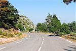 country mountain road at sunny summer day