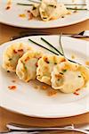 polish pierogi dish - dumplings with meat on white plate