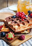 Belgian waffles with fresh berries for breakfast