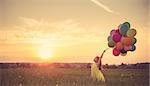 Little girl with balloons
