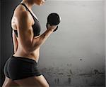 Athletic muscular woman workout with grunge background