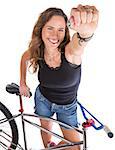 Isolated beautiful mountain biker showing her fist
