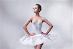 beautiful woman ballet dancer posing in studio