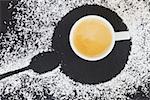 cup of fresh coffee espresso with foam and sugar, top view