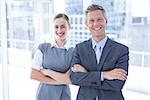 Business colleagues smiling at the camera in the office