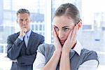 Businesswoman with hands on her face in the office