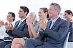Business team applauding during conference in the office