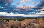 View over kasbahs (fortified houses) to flat desert plains and Jbel Sarhro Mountains, Nkob, Southern Morocco, Morocco, North Africa, Africa