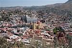 The Basilica de Nuestra Senora de Guanajuato, the yellow building in centre, with the blue grey building of the University of Guanajuato behind, in Guanajuato, a UNESCO World Heritage Site, Guanajuato State, Mexico, North America