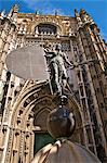 Cathedral and a reproduction of the Giralda statue representing the Victorous Faith weather vane, Seville, Andalusia, Spain, Europe