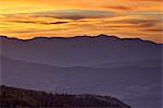 Orange clouds at sunset over layered mountains, Manti-La Sal National Forest, Utah, United States of America, North America