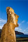 Lone monolithic giant stone Moai statue looking out to sea at Tongariki, Rapa Nui (Easter Island), UNESCO World Heritage Site, Chile, South America