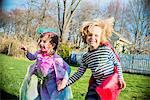 Children in costumes playing outdoors