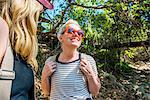 Women hiking in forest, El Capitan, California, USA