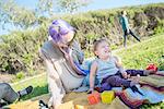 Mother and baby at picnic, El Capitan, California, USA