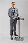 Businessman having presentation, studio shot