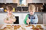 Boys decorating gingerbread cookies