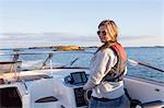 Smiling woman on boat