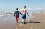 Boys walking on beach