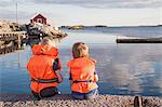 Boys sitting on jetty