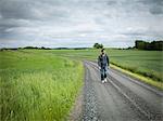 Man walking on dirt track