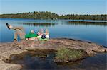 Men relaxing at lake
