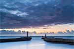 United Kingdom, England, North Yorkshire, Whitby. The Piers at dusk.