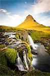 Kirkjufell Mountain, Snaefellsnes peninsula, Iceland. Landscape with waterfalls, long exposure on a sunny day