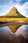 Snaefellsnes peninsula, Iceland. Kirkjufell Mountain reflecting on water.