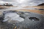 Iceland, Hverir, geothermal area in Northern Iceland, with steam and mud pools. tourists enjoying the view