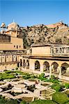 India, Rajasthan, Jaipur, Amer.  The Mughal Gardens at Amber Fort with Jaigarh Fort situated on a promontory called Cheel ka Teela (Hill of Eagles) in the distance.