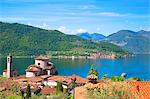 Italy, Lombardy, Lake Iseo. Along the Antica Strada Valeriana which runs across part of the lake with the Church at Sale Marasino and Monte Isola.