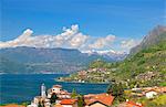 Italy, Lombardy, Lake Iseo. Along the Antica Strada Valeriana which runs across part of the lake with the Church at Sale Marasino and Monte Isola in the background.
