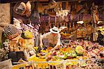 Italy, Emilia Romagana, Bologna. Man in a food shop selling typical Emilia Romagna food.