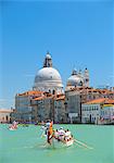 Italy, Veneto, Venice. During the Vongalonga rowing boats in front of the Santa Maria della Salute Church on the Gran Canal.