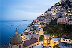 Positano, Amalfi Coast, Campania, Sorrento, Italy. View of the town and the seaside in a summer sunset