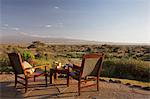 Kenya, Amboseli National Park, Tortilis Camp. Sundowner set for two, overlooking Mount Kilimanjaro.