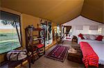 Kenya, Mara North Conservancy. The interior of a luxury safari tent in Elephant Pepper Camp.