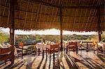 Kenya, Amboseli, Tortilis Camp. The dining room at Tortilis in the evening light.